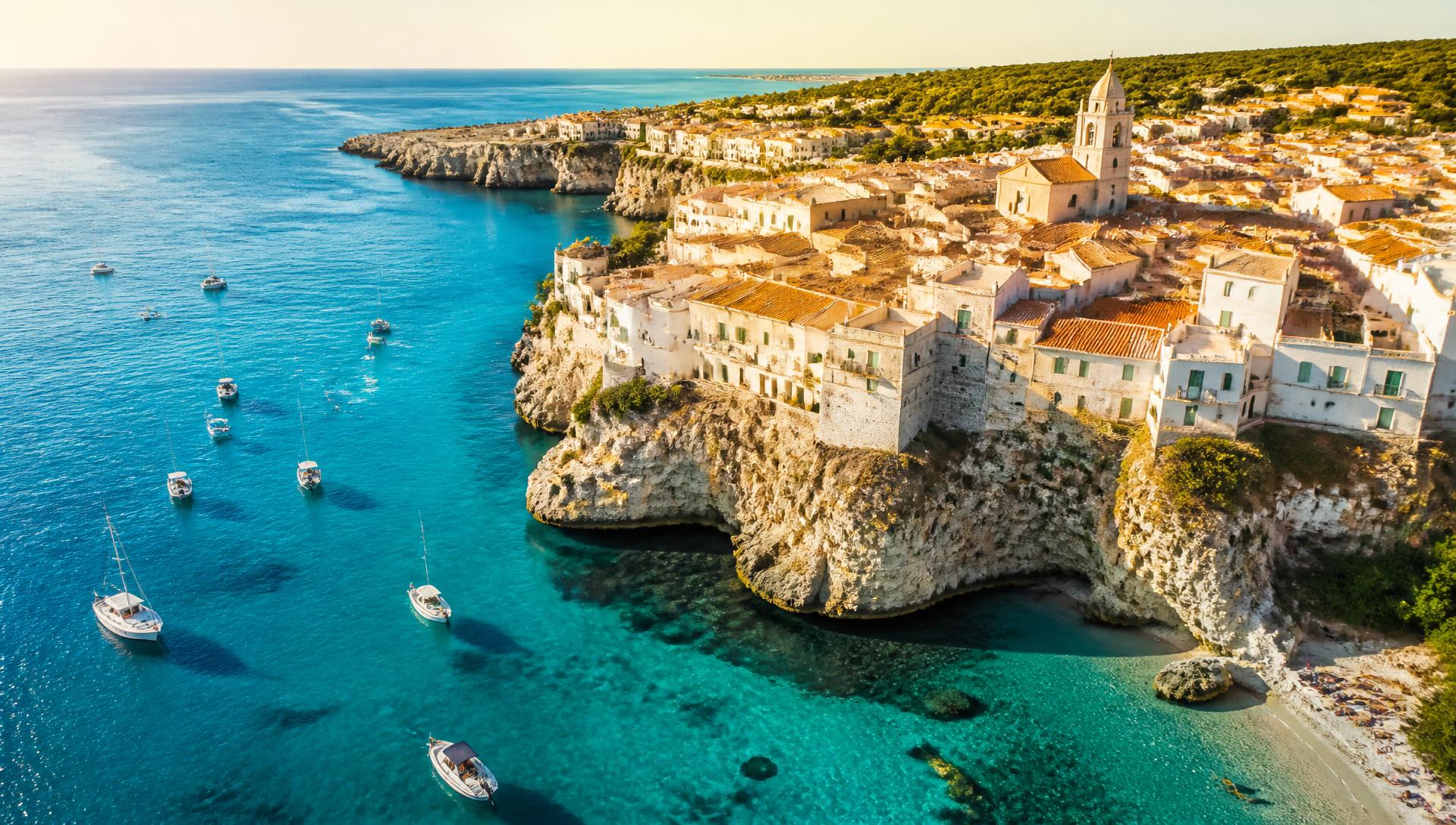 Mediterranean coastline with turquoise water and a cliffside village